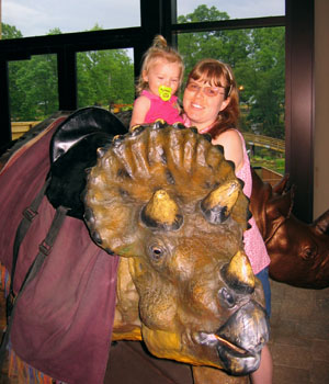 We had to get take a couple photos of them to get one that looked like they were not terrified of the Triceritops.  They enjoyed seeing but not sitting.
